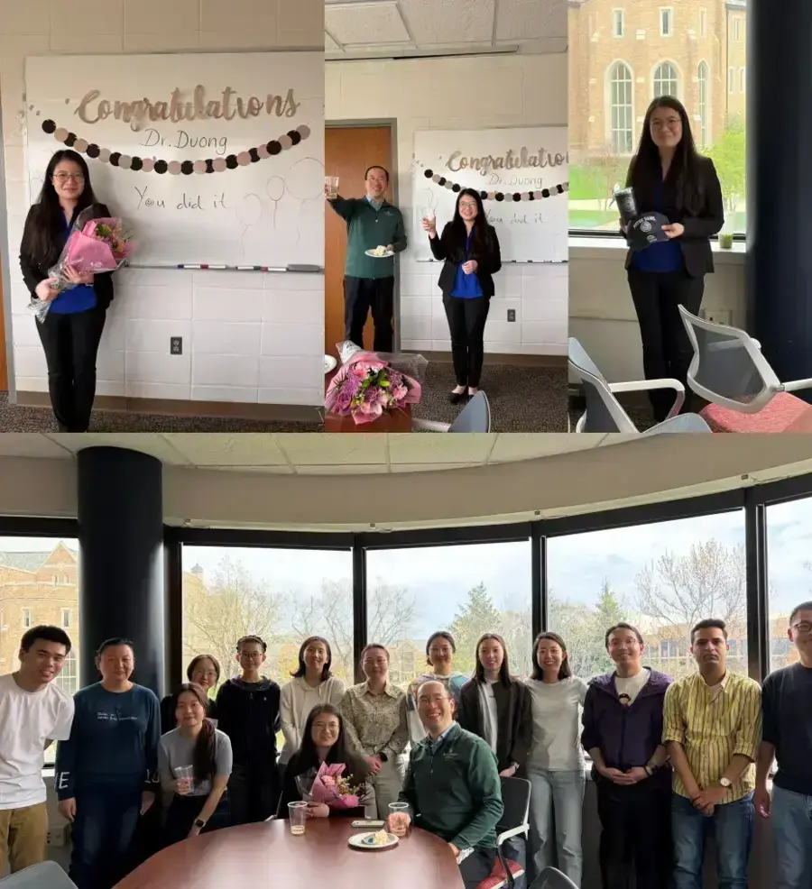 Dr. Duong smiles, holding flowers and Notre Dame gifts, celebrating with colleagues against a campus building backdrop.